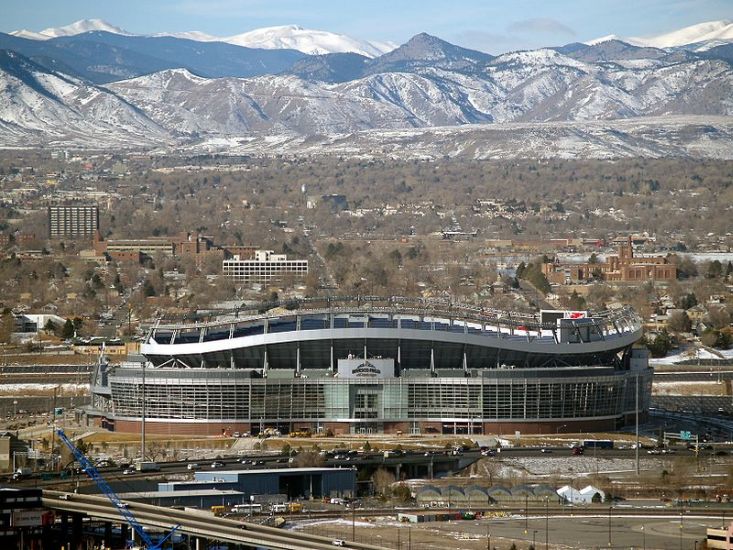 Invesco Field in Denver beneath the Rocky Mountains in Colorado, USA