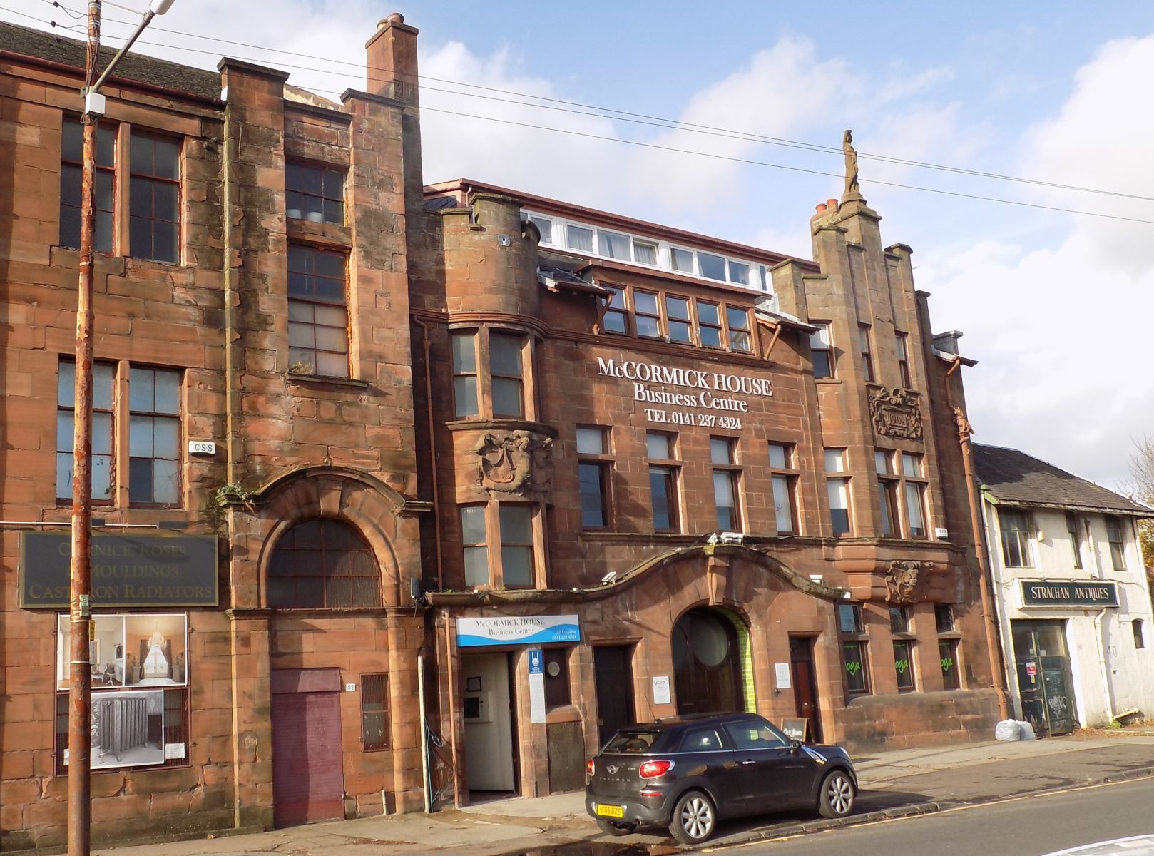 McCormick House in Darnley Street - Print works built 1902 in the Art Nouveau style - statue of Minerva and the lead griffin rainwater collector